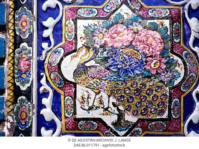 Peacock and flowers, polychrome tile decoration in Tekyeh Mo'aven ol-Molk, Kermanshah, Iran