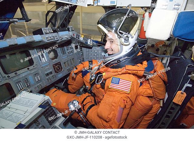 While seated at the pilot's station, astronaut George D. Zamka, STS-120 pilot, participates in a training session in the crew compartment trainer (CCT-2) in the...