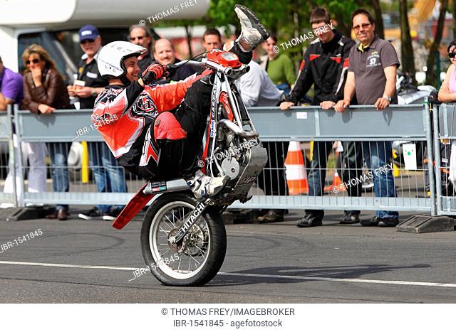 Stuntman Mike Auffenberg driving a trial motorcycle without a front wheel, Koblenz, Rhineland-Palatinate, Germany, Europe