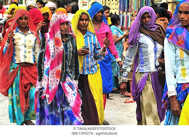 Pilgrims walking on the shopping street at Lakshman Jhula in Rishikesh