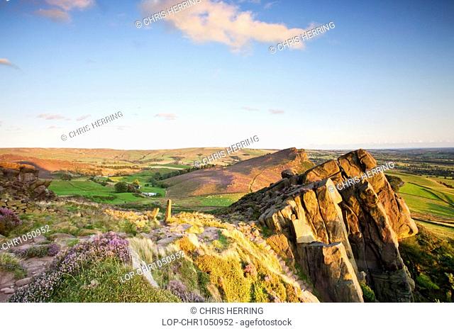 England, Staffordshire, The Roaches, The Roaches, a wind-carved outcrop of gritstone rocks, illuminated by warm evening light in the Peak District National Park