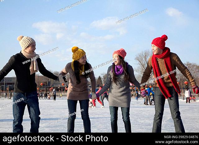 Friends on ice rink