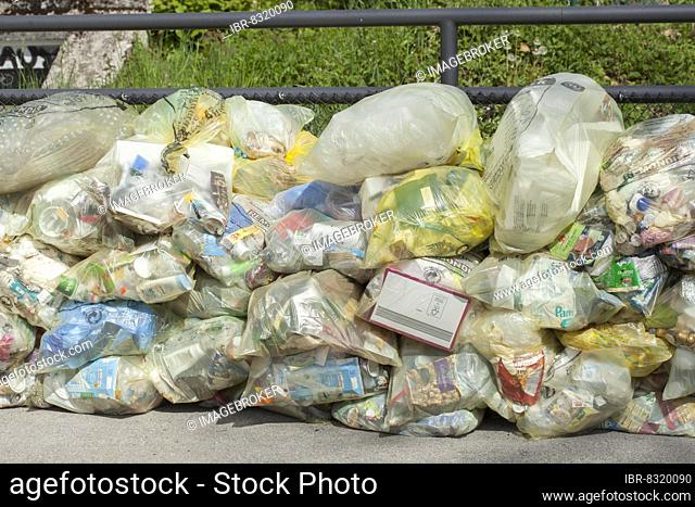 Stacked yellow bags for plastic waste, Germany, Europe