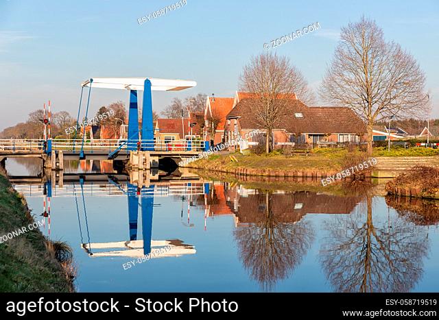 Farmhouses and drawbridge over canal near Smilde in Drenthe, The Netherlands