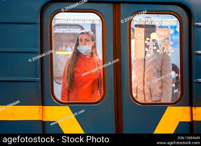 UKRAINE, KIEV - MAY 26, 2020: subway station Zoloty Vorota (Golden Gate). People in a subway car