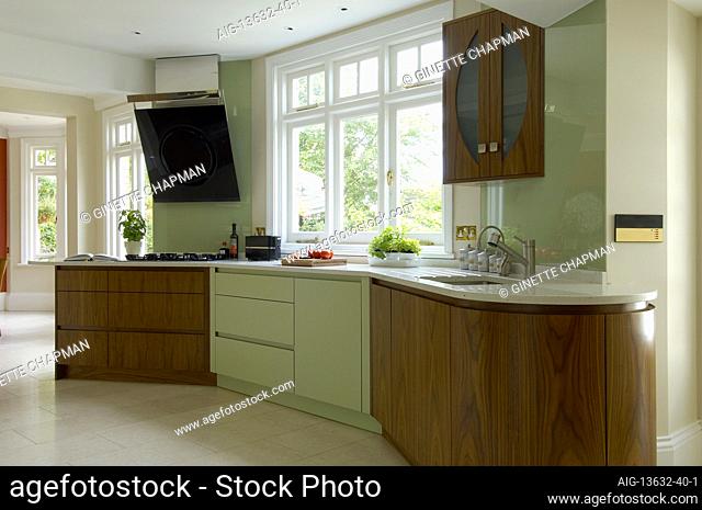 Contemporary Art Deco style walnut and mint Kitchen refurbishment