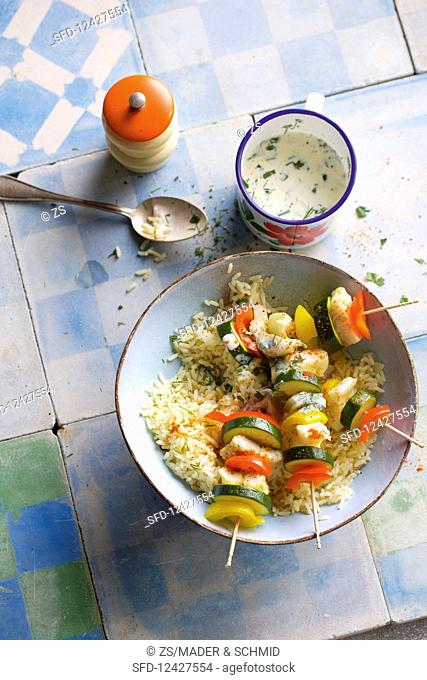 Fish and vegetable skewers with rice