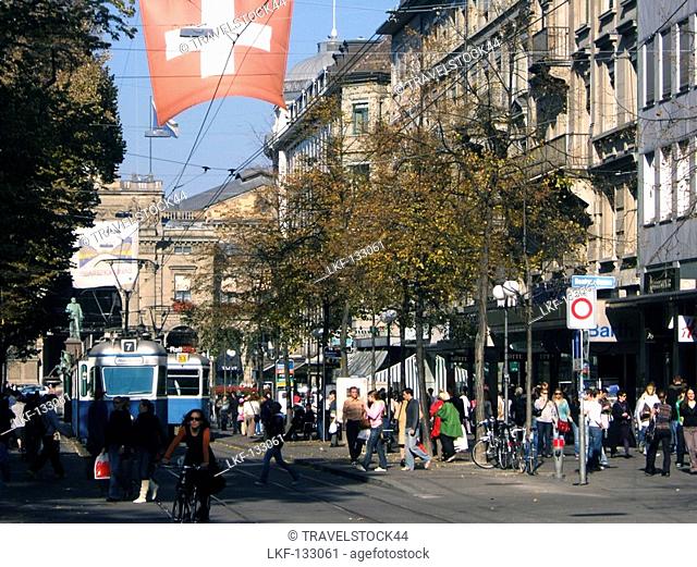 Switzerland, Zurich, Bahnhofstrasse, tram, swiss flag, people, spopping area