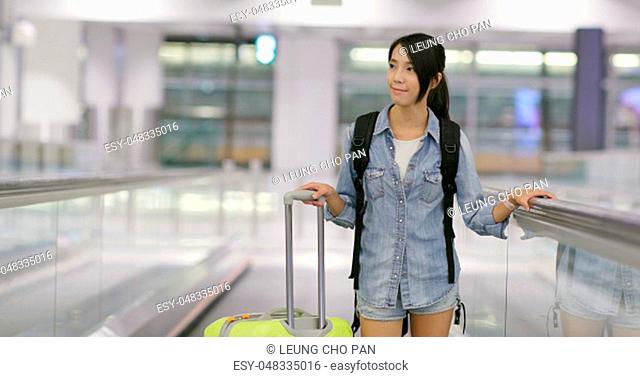 Woman go travel and carry with luggage in the airport