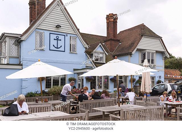 Customers sitting outside The Anchor pub in Walberswick , Suffolk , England , Britain , Uk