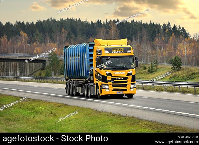Next Generation Scania R500 truck of TransPeltola Oy hauls Bruhn Spedition cargo container on motorway in autumn. Salo, Finland. October 31, 2020