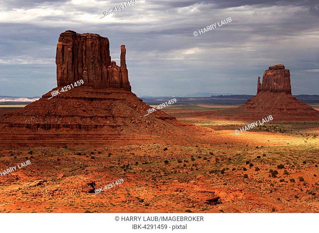 Rock formations, West Mitten Butte and East Mitten Butte, after storm, clouds, evening light, Monument Valley Navajo Tribal Park, Arizona, USA