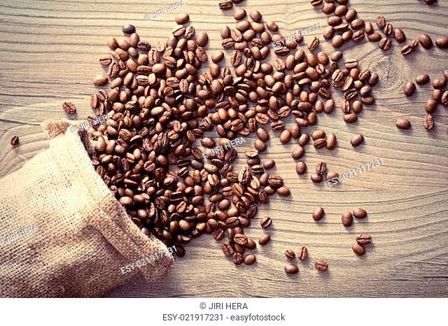 coffee beans spill out of the sack