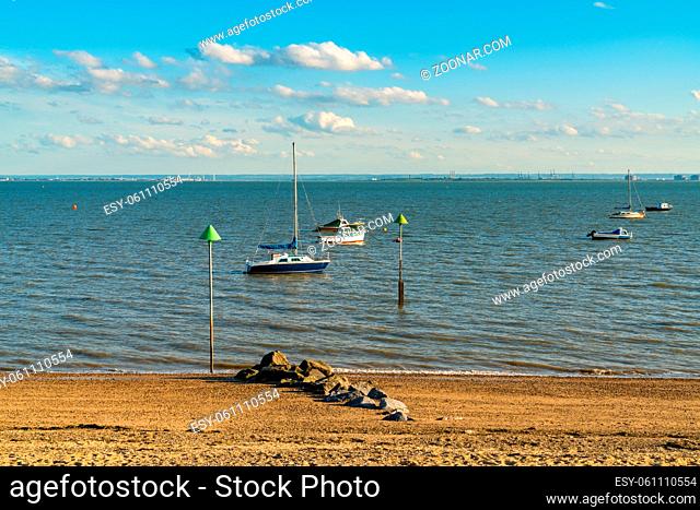 Boats on the shore of the River Thames, seen in Southend-on-Sea, Essex, England, UK