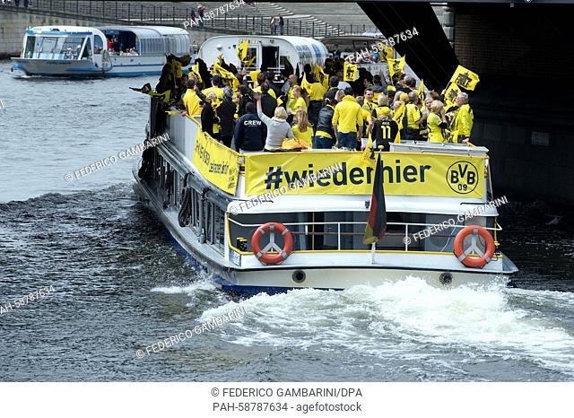 FILE - a file picture dated 17 May 2014 shows BVB fans taking a trip on the river Spree in Berlin, Germany. Photo: Federico Gambarini/dpa | usage worldwide