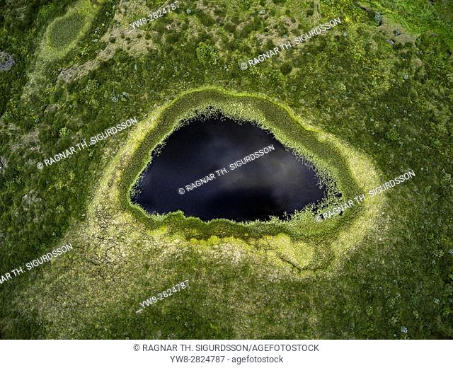 Aerial view of Skutustadagigar Pseudocrater, Lake Myvatn, Iceland. The craters were formed by steam explosions, when boiling lava flowed over the wetlands