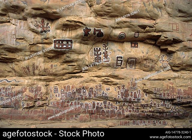 Circumcision site. Traditional ceremonial practice. Rock art. Painted images on rock wall