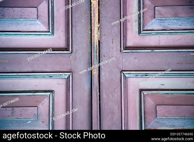 abstract samarate  rusty brass brown knocker in a door curch closed wood lombardy italy varese