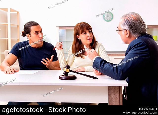 Lawyer talking to divorcing couple at the home