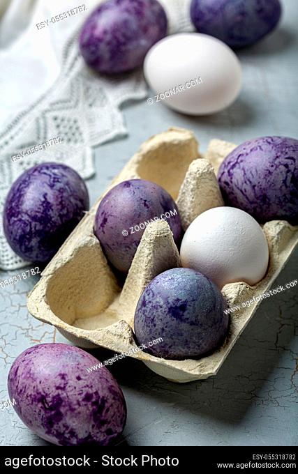 Happy Easter card. Naturally colored Easter eggs lying in the tray, selective focus