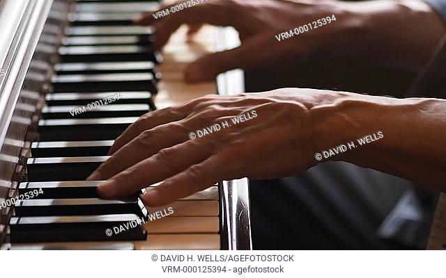 Hands of a musician playing piano in Providence, Rhode Island