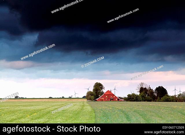 stormy clouds over Dutch farmland, Netherlands