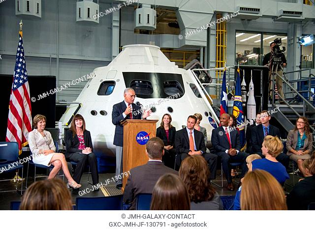 NASA Administrator Charlie Bolden, at lectern in the middle of the frame, speaks at a special media-day program at the Johnson Space Center's Space Vehicle...