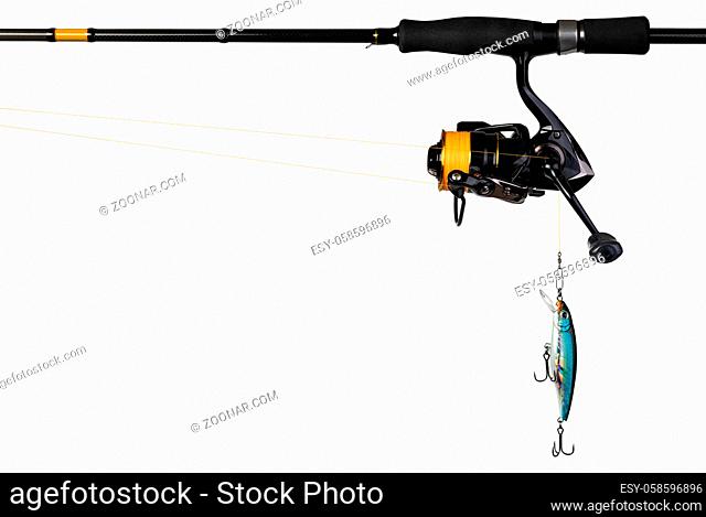 Spinning rod, reel and fishing baits isolated on white background
