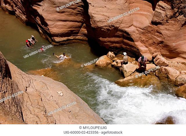 Visitors to HAVASU CREEK which comes out of the Havasupai Indian Reservation where hikers can enter - GRAND CANYON NATIONAL PARK, ARIZONA