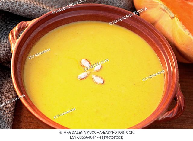 Bowl with pumpkin soup