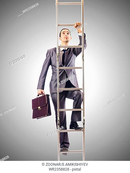 Businessman climbing the ladder against the gradient