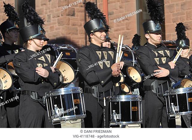 Members of a marching band stand ready to perform during the Thanksgiving Day Parade in Waterloo, Ontario, Canada. Thanksgiving Day is a national holiday which...