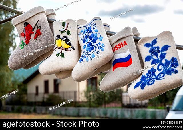 Russian traditional souvenirs. Winter felt boots with drawns. National shoes for winter use