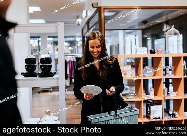 Smiling woman doing shopping