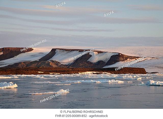 View of coastal ice floes, with mountains in background, Spitsbergen, Svalbard, august