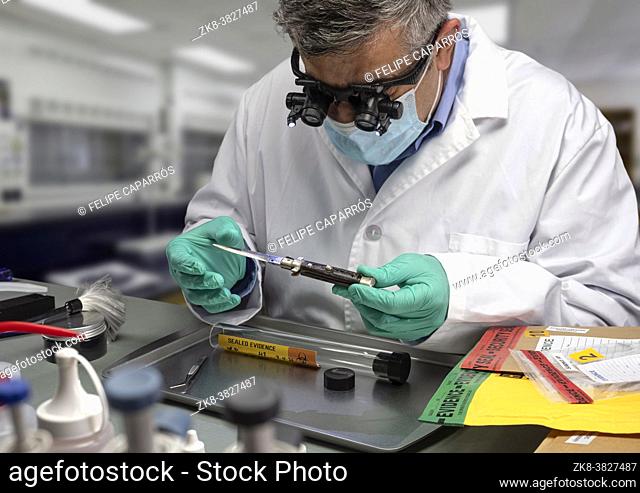 Forensic police analyse knife used in murder at crime lab with magnifying glasses, concept image