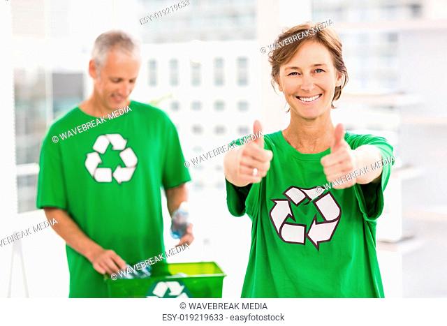 Smiling eco-minded woman doing thumbs up