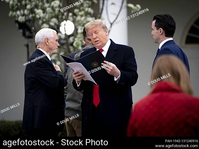 United States President Donald J. Trump and US Vice President Mike Pence look over some notes as they participate in a Fox News Virtual Town Hall with Anchor...