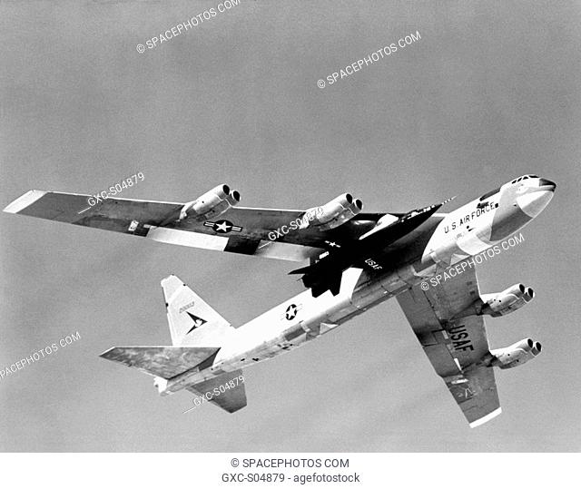 One of three X-15 rocket-powered research aircraft being carried aloft under the wing of its B-52 mothership. The X-15 was air launched from the B-52 so the...