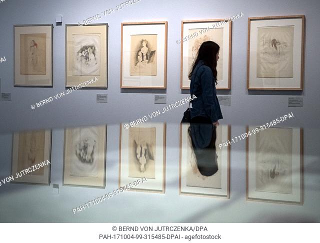 A woman looking at the the exhibition ""Jeanne Mammen - The Observer - Retrospective 1910Â·1975"" during a press conference at the Berlinische Galerie in Berlin