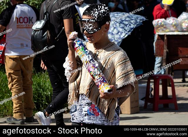 Children throw flour and foam during the Carnival of Blancos Y Negros on January 3, 2022 in Pasto - Nariño, Colombia. This UNESCO-recognized carnival takes...