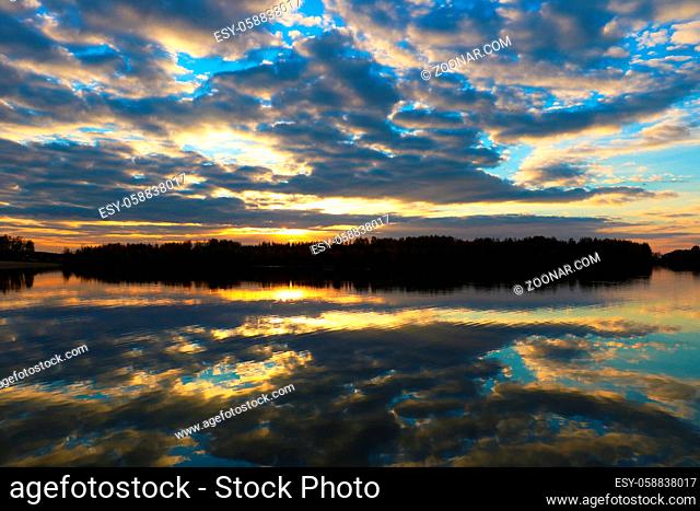 Sunset scene over lake water surface