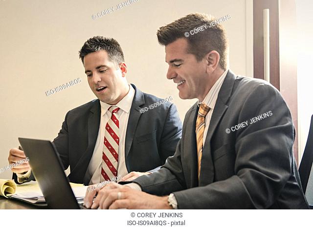 Two male business lawyers having a planning meeting in office