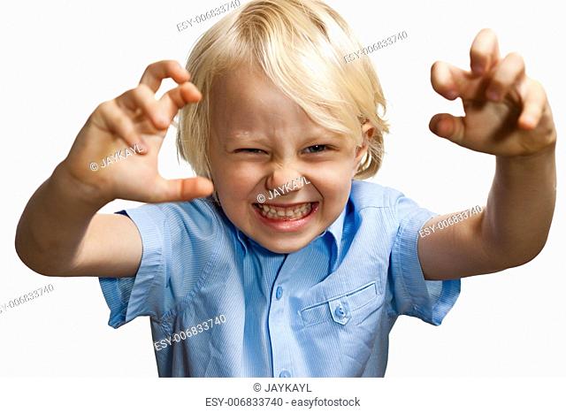 Isolated portrait of a cute young boy pretending to be scary