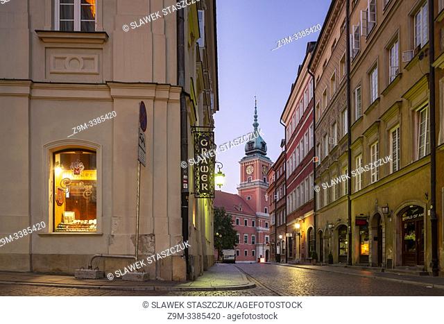 Dawn in Warsaw old town, Poland. Royal Castle in the distance