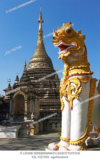 Chedi and mythical lion figure in Wat Chetawan  Chiang Mai, Thailand