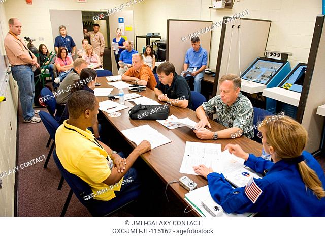 STS-133 crew members are pictured in a classroom setting during a training session in the Space Vehicle Mock-up Facility at NASA's Johnson Space Center
