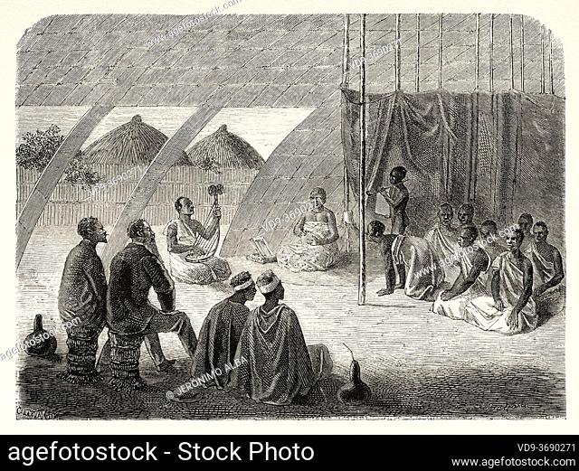 King Mutesa's guards at rations, Africa. Old XIX century engraved from Le Tour du Monde 1864