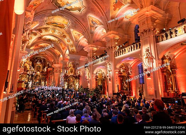 18 December 2023, Baden-Württemberg, St. Peter: People sit during a TV recording in the parish church of St. Peter. The traditional concert with Federal...