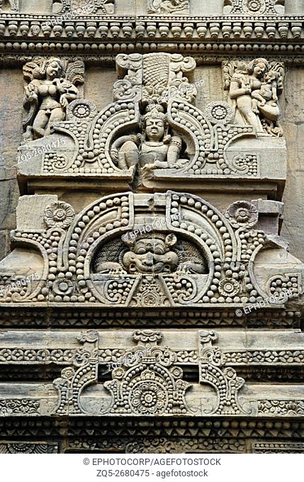 Orissa Bhubaneshwar Parasuramesvara Temple- Ornamentation above empty niche on the outer side of the main deul, picture showing lion in the centre with seated...